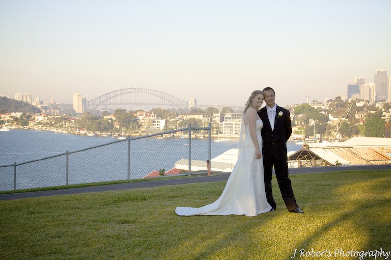 Bride and groom on Cockatoo Island with harbour in the background - wedding photography sydney